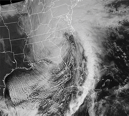 The massive comma-shaped cloud of the Superstorm of March 13-14, 1993, envelopes the entire eastern United States. Click here for an animation of this "Storm of the Century."