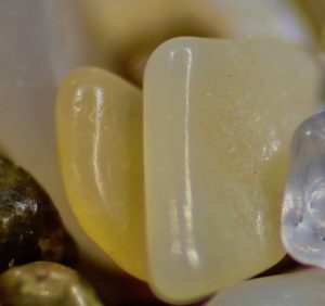 The glassy sand from Rings Beach, New Zealand, was yellow, purple, and pink.