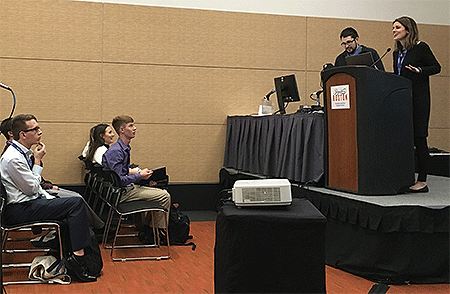 Karen Kosiba, with the Center for Severe Weather Research, answers students' questions Saturday at the AMS 100th Annual Meeting.