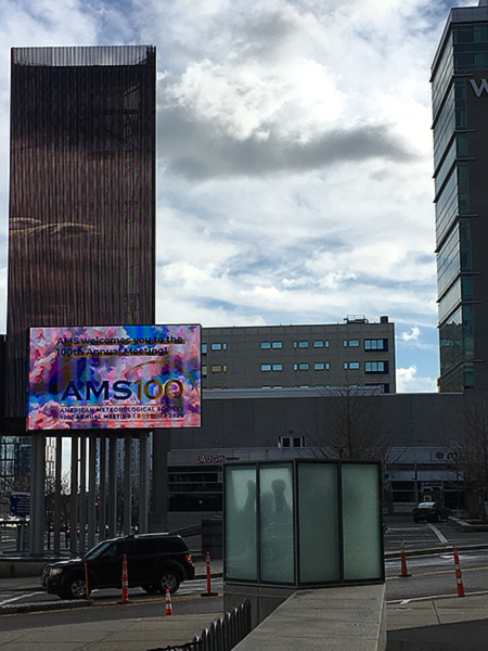 The marquee at the Boston Convention and Exhibition Center announces AMS100. The temperature was a record 69 degrees at the time.