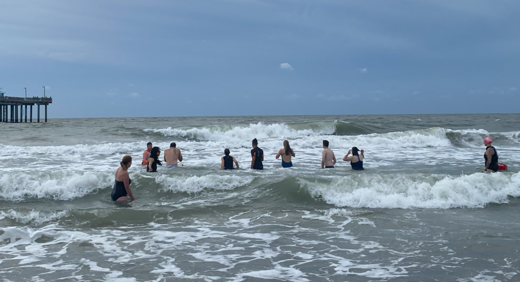 BlueIQ participants wade in the ocean