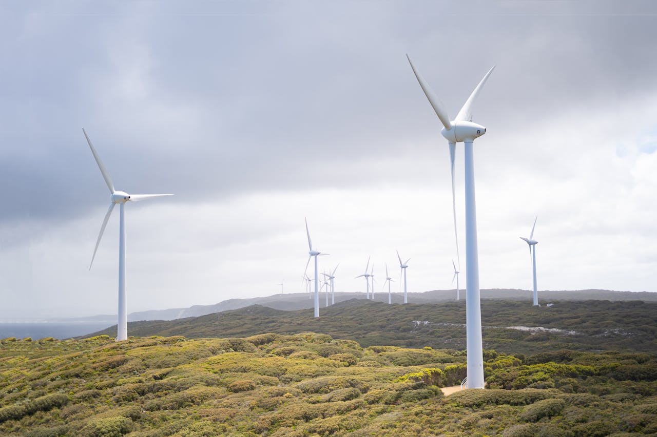 Photo by Harry Cunningham @harry.digital: https://www.pexels.com/photo/photo-of-wind-turbines-under-cloudy-sky-3619870/