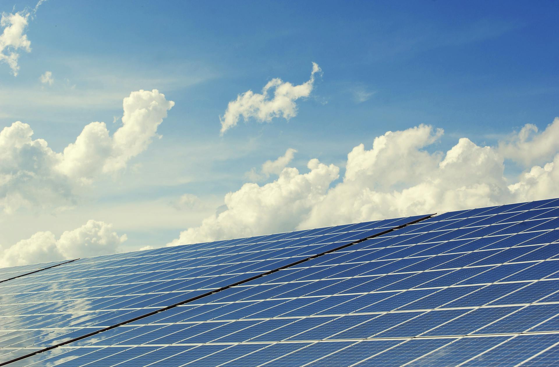 Solar panels with clouds in the background. Photo: Pixabay from Pexels